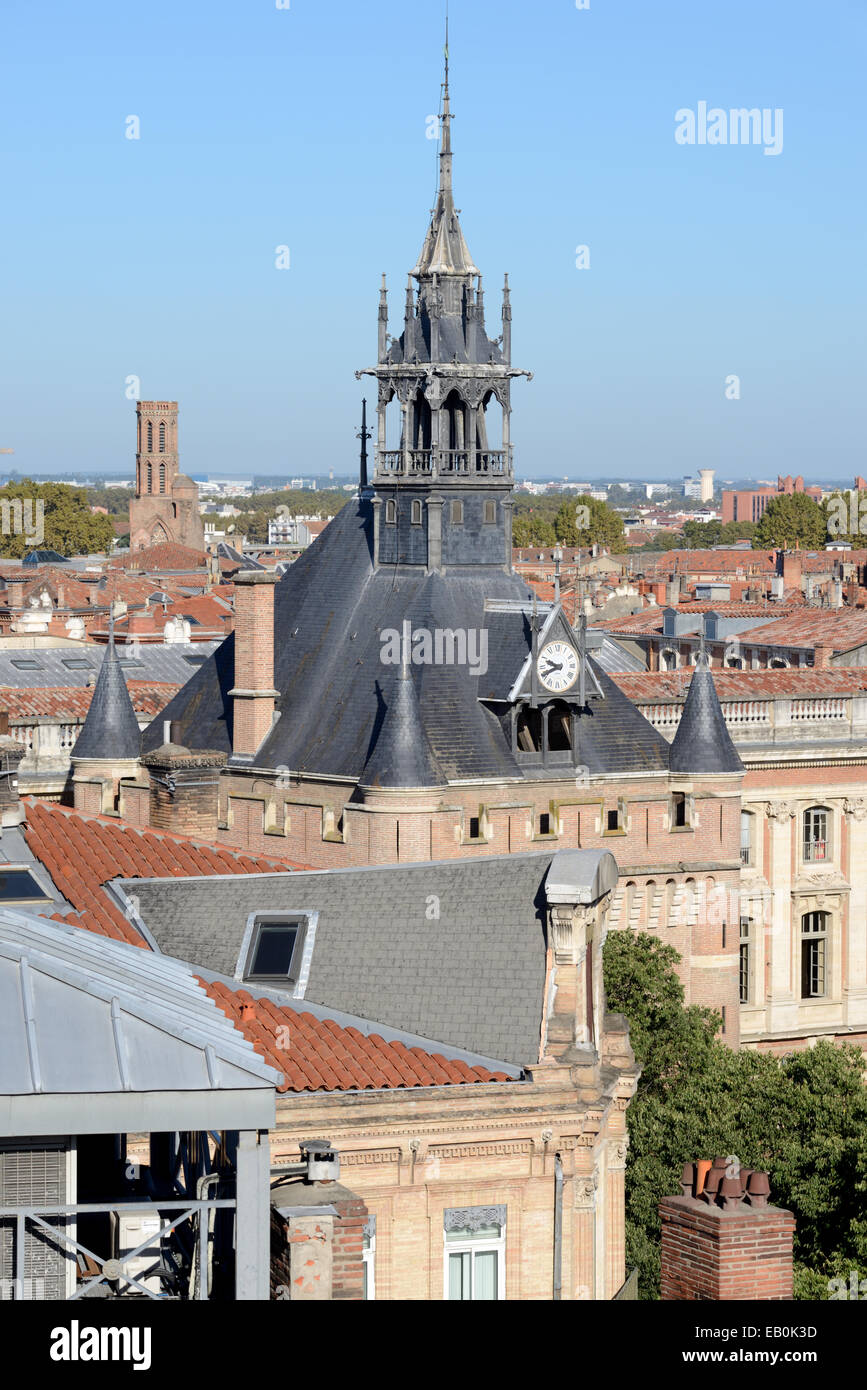 View over Rooftops & the c19th Pinnacle of the Medieval Tower Dungeon or City Keep near the Capitole Toulouse France Stock Photo