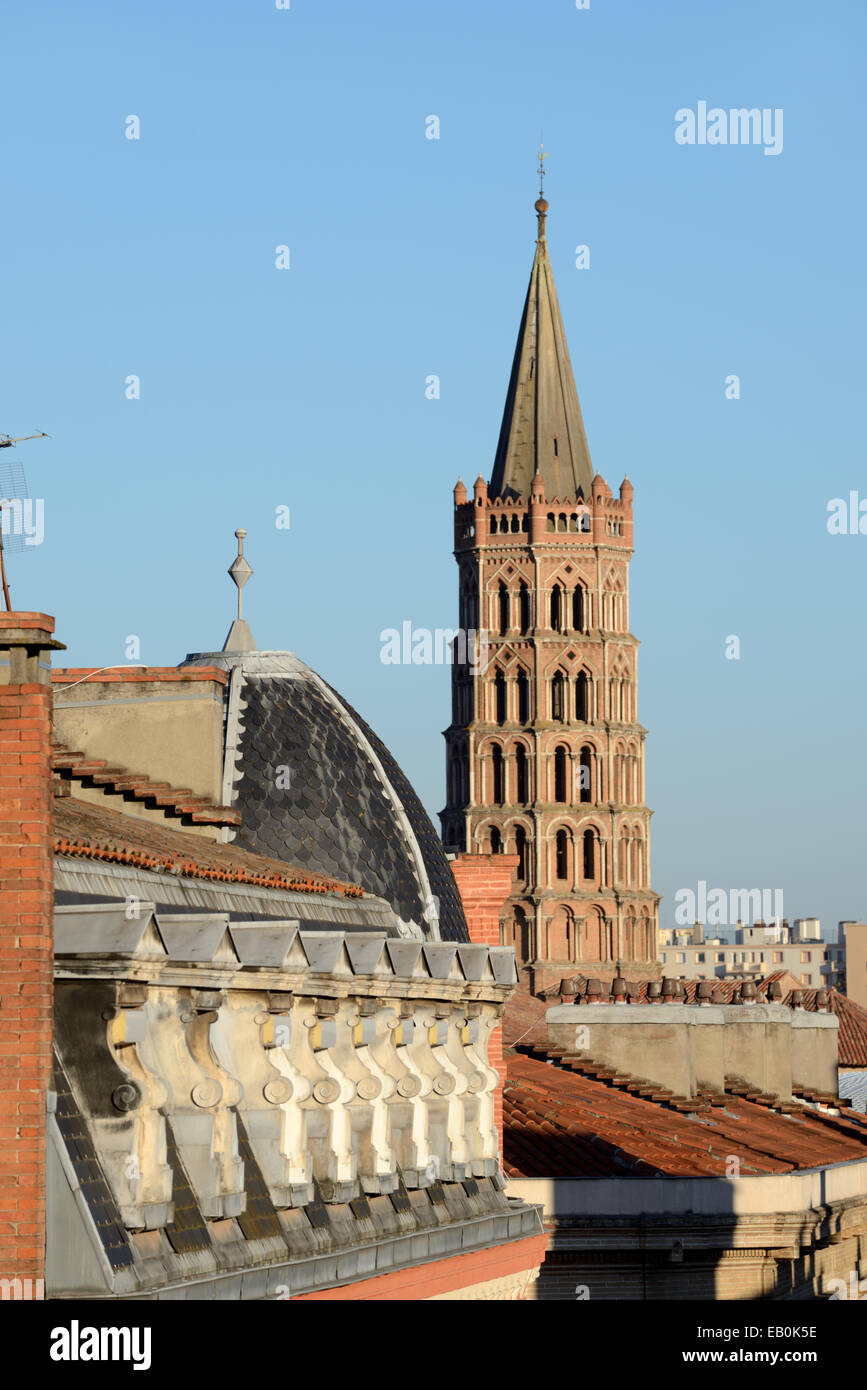 Red-Brick Belfry of the Saint Sernin Romanesque Basilica or Church & Rooftops or Skyline of Toulouse France Stock Photo