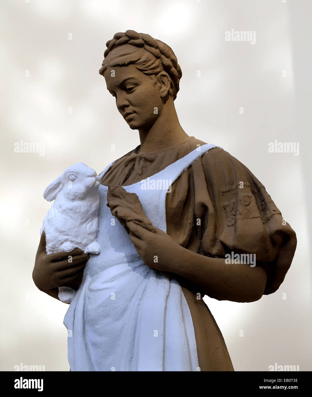 Statue of a girl with a rabbit in the exhibition pavilion building ...