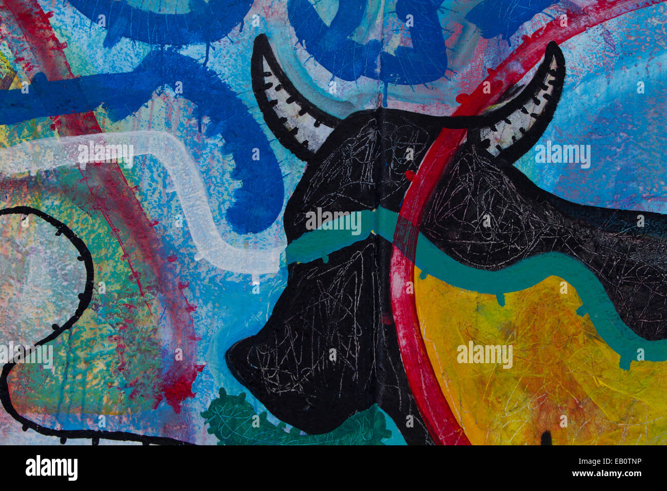 Berlin Wall Cartoon bull horns Graffiti street art Stock Photo