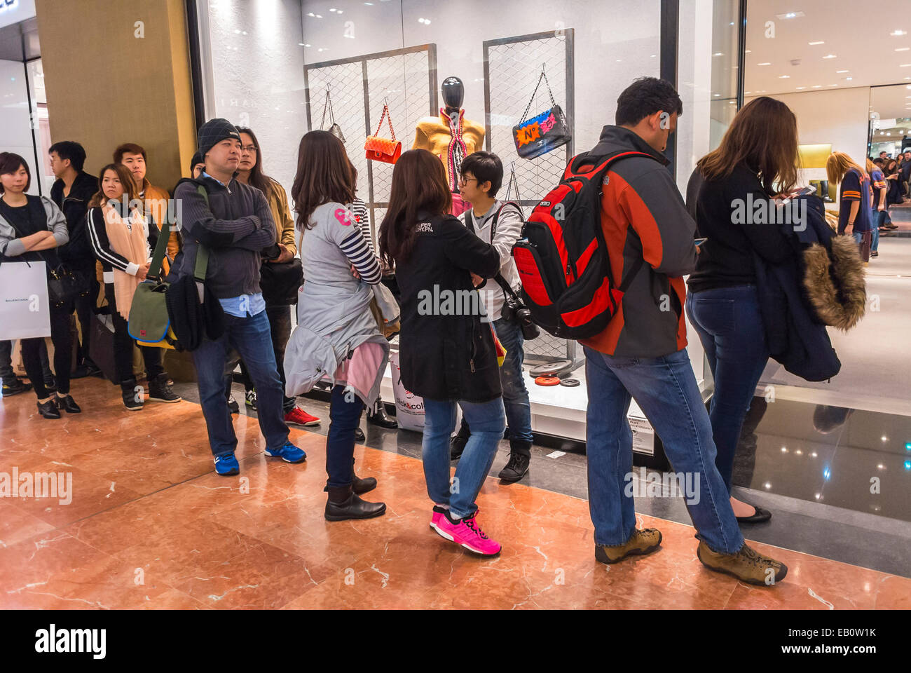 Paris, France, Chinese Tourists Shopping Queuing, lining up, inside French busy, Department Store, 'Galeries Lafayette', 'Louis Vuitton' Luxury Brand Shop haute couture interior, Prestige consumer shoppers Stock Photo