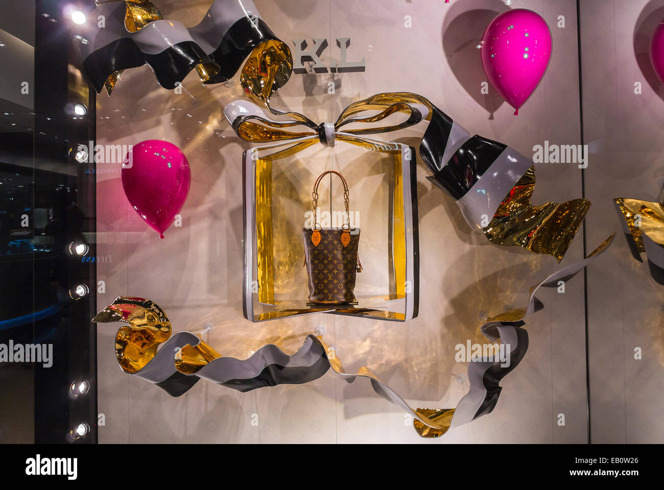 LV,  in a shop window at the Louis Vuitton store in the …