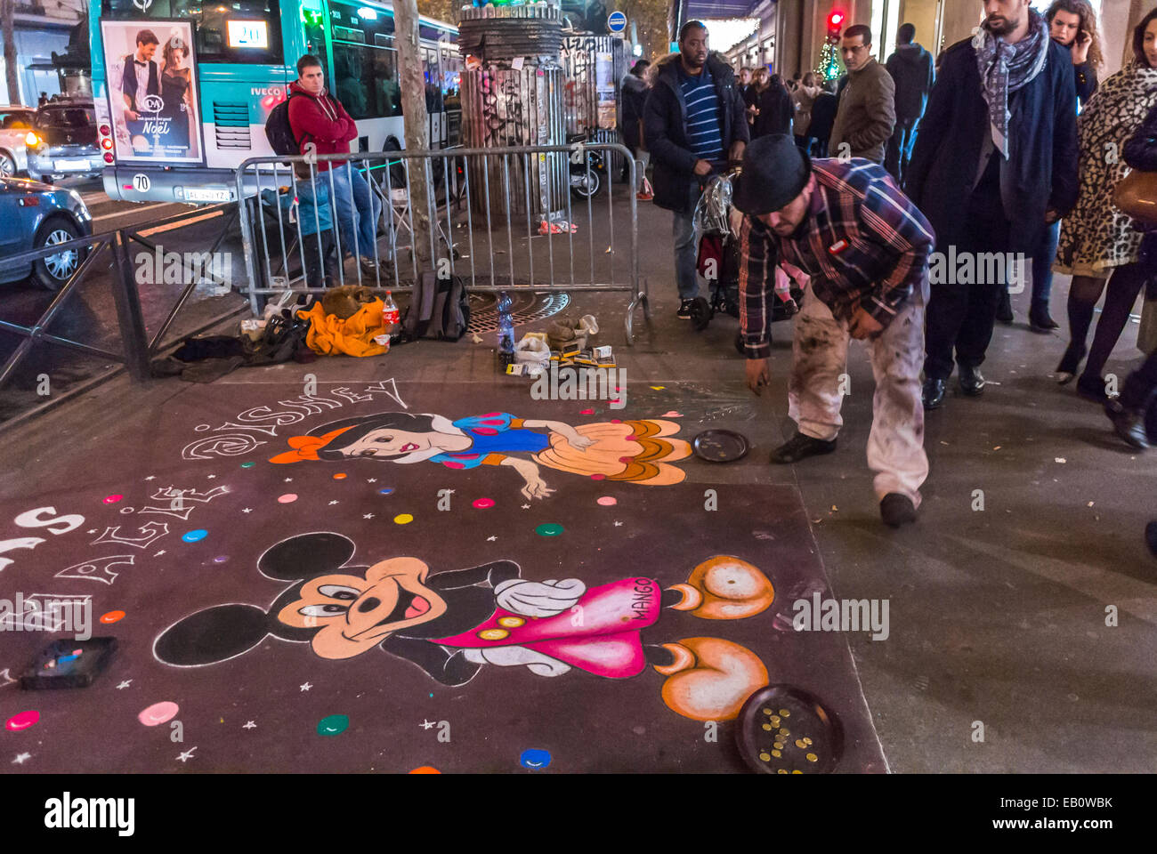 Paris, France, Sidewalk Graffiti Street Artist drawing Disneyland Characters, Outside  Department Store at Night Stock Photo