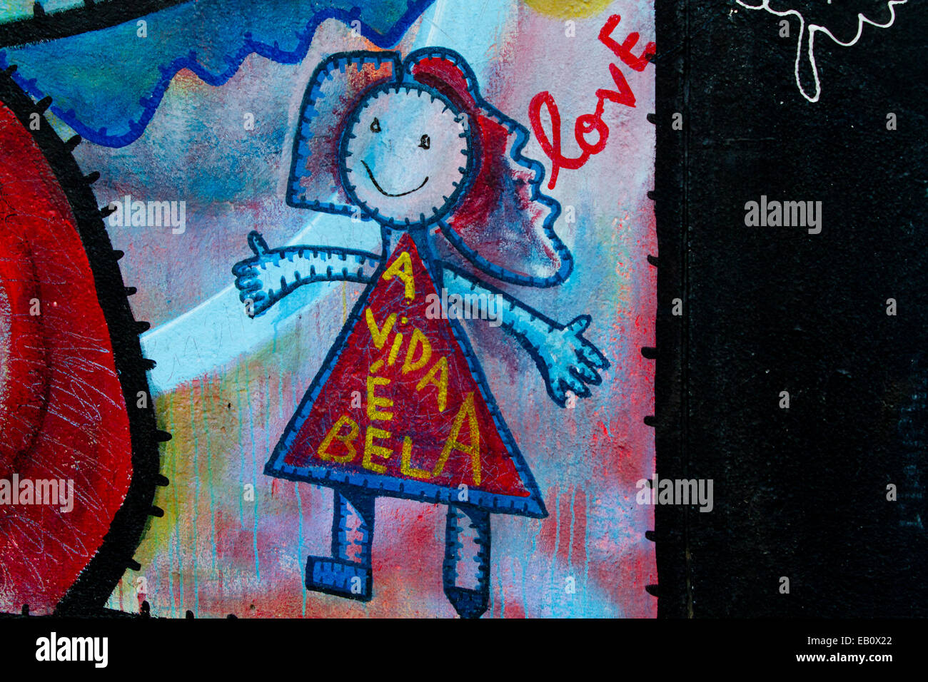 Berlin Wall Cartoon girl doll Graffiti street art Stock Photo