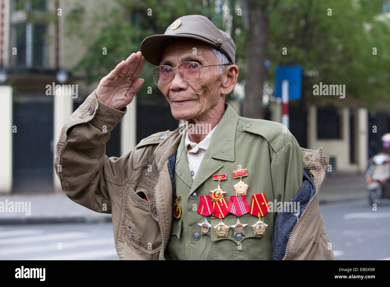 Vietnamese military veteran saluting outside of Ho Chi Minh Mausoleum in Hanoi Vietnam Stock Photo