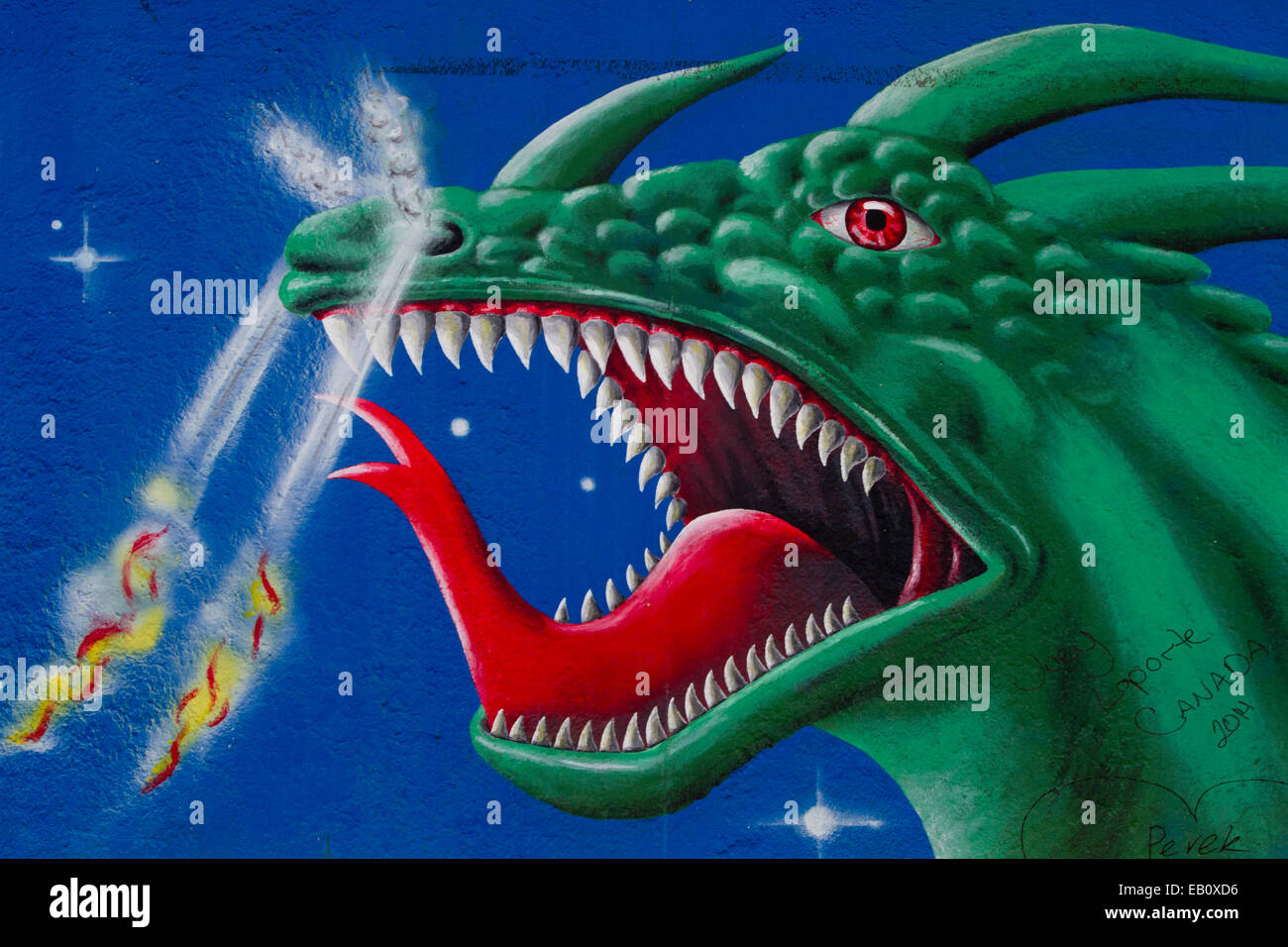 Berlin wall Street Art Graffiti Green Dragon monster Stock Photo