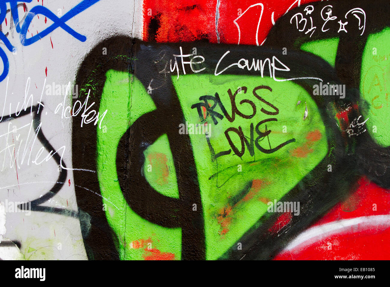 Graffiti drugs love tags street art Berlin wall Stock Photo