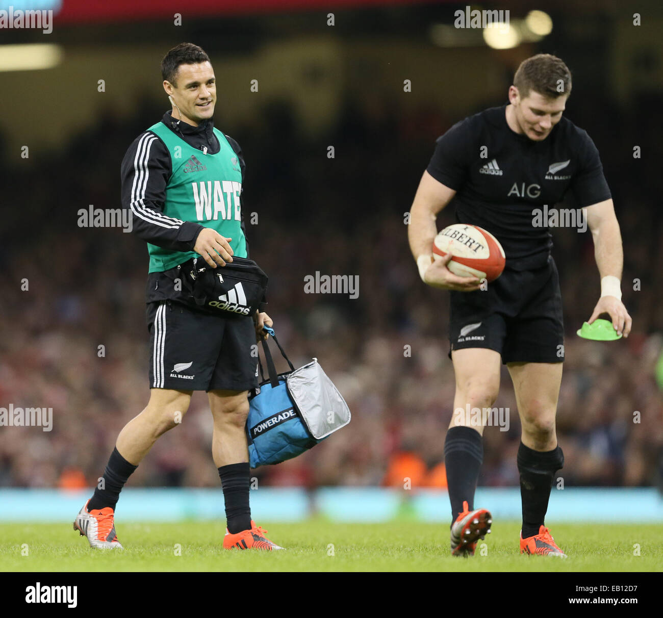 Cardiff, UK. 22nd Nov, 2014. Dan Carter of New Zealand (L) the water boy for the day - Autumn Test Series - Wales vs New Zealand - Millennium Stadium - Cardiff - Wales - 22nd November 2014 - Picture Simon Bellis/Sportimage. © csm/Alamy Live News Stock Photo