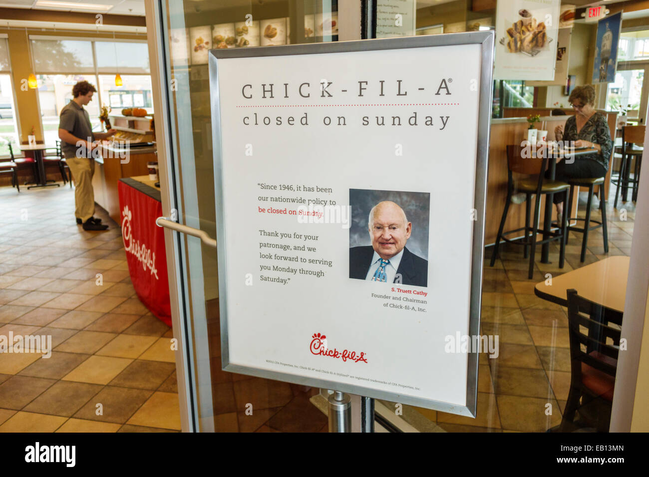 Florida,Palm Bay,Chick-fil-A,restaurant restaurants food dining cafe cafes,fast food,interior inside,entrance,sign,closed Sunday,policy,S. Truett Cath Stock Photo