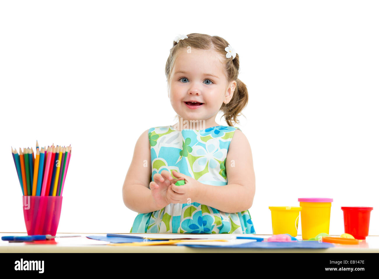 lovely girl drawing with colorful pencils Stock Photo