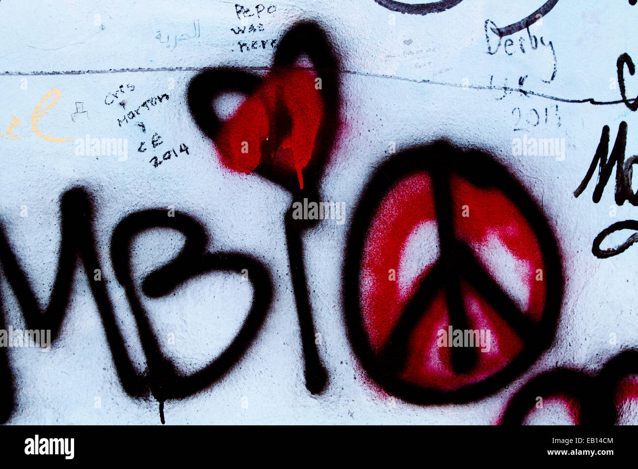 Graffiti street art Berlin wall CND bleeding Heart Stock Photo