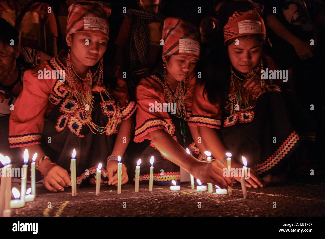 A group of young girls from Mindanao light up candles in front of the Redemptorist church in Baclaran, Paranaque. Hundreds of delegates from Mindanao, together with protest groups from southern Luzon held a candle lighting event in commemoration of the 5th anniversary of the Maguindanao massacre, where 58 people was murdered. 32 of the victims were journalists. © J Gerard Seguia/Pacific Press/Alamy Live News Stock Photo