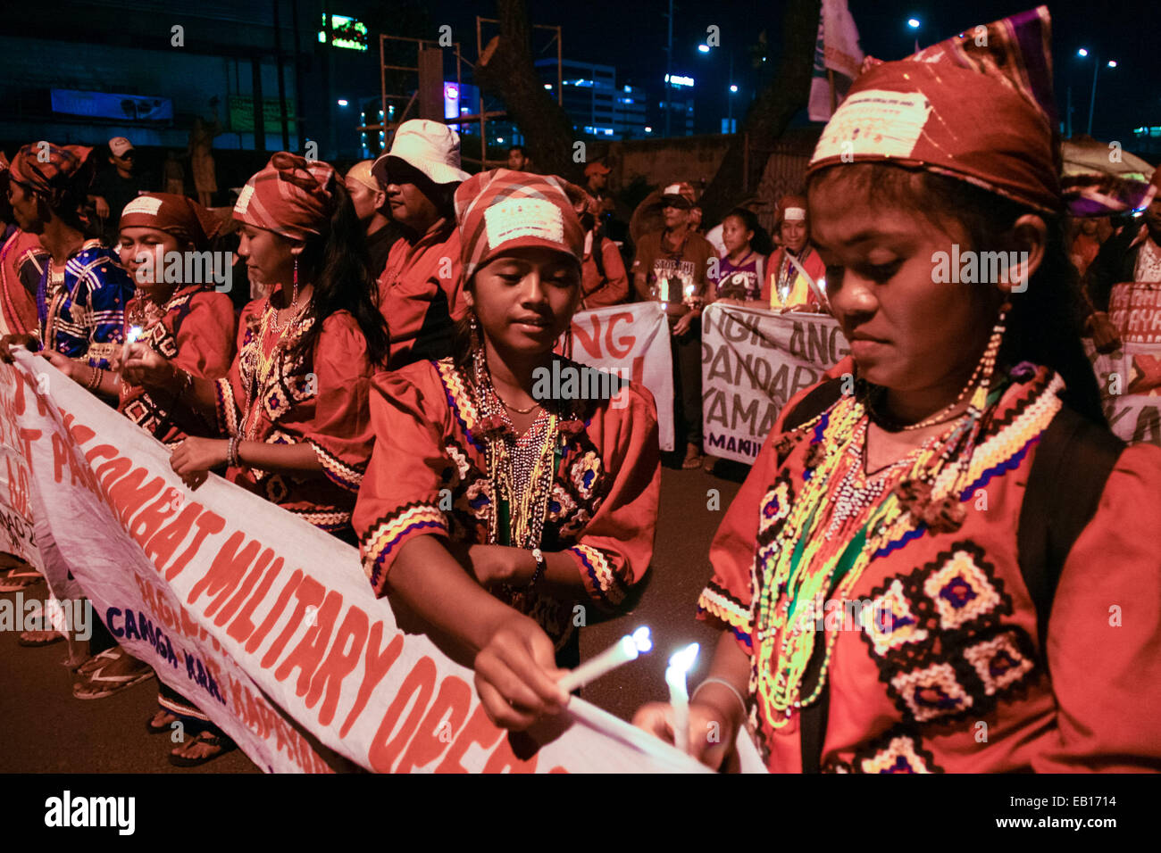 Members of the group Lakbay from Mindanao light up candles as they approach the Redemptorist church in Baclaran, Paranaque. Hundreds of delegates from Mindanao, together with protest groups from southern Luzon held a candle lighting event in commemoration of the 5th anniversary of the Maguindanao massacre, where 58 people was murdered. 32 of the victims were journalists. © J Gerard Seguia/Pacific Press/Alamy Live News Stock Photo