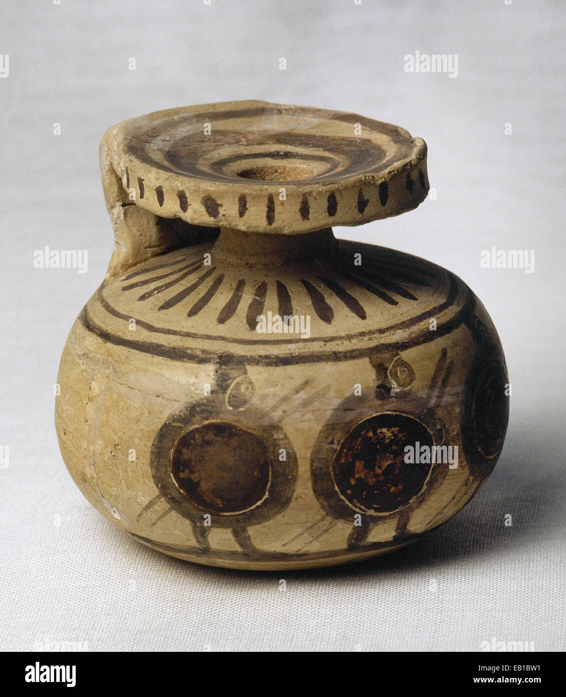 Aryballos, used to contain perfume or oil, decorated with four warriors with shield, helmet and spear. From Corinto. Greece. Stock Photo