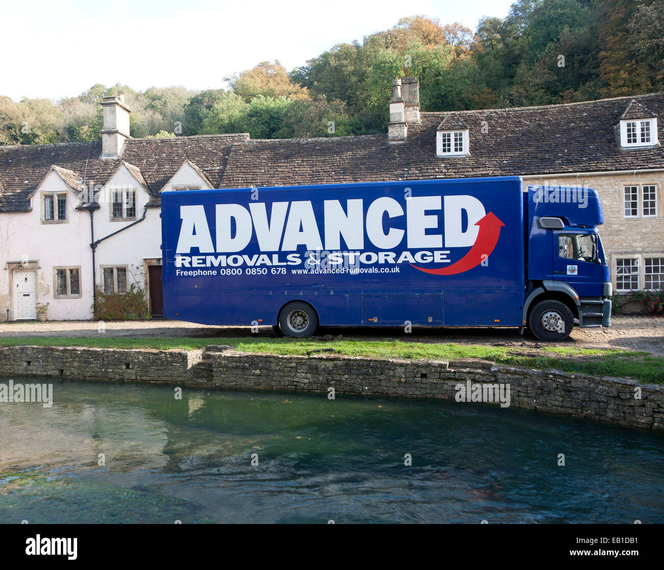 Removal van in Castle Combe, Wiltshire, England, UK claimed to be England's prettiest village Stock Photo