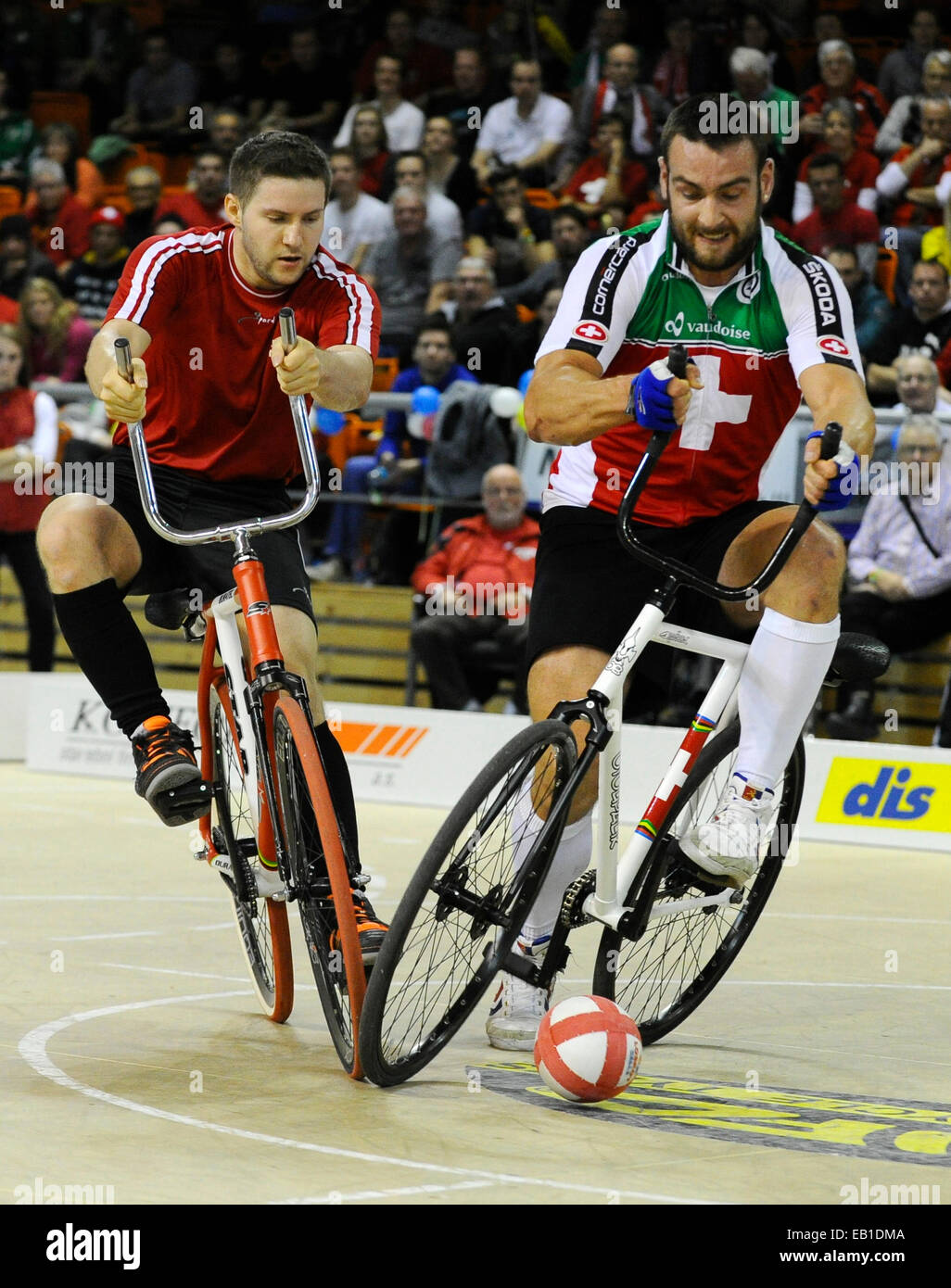 Dominik Planzer of Schwitzerland, right, and Markus Broell of Austria pictured during the Cycle Ball final at the Indoor Cycling World Championships 2014 in Brno, Czech Republic, November 23, 2014. (CTK Photo/Vaclav Salek) Stock Photo
