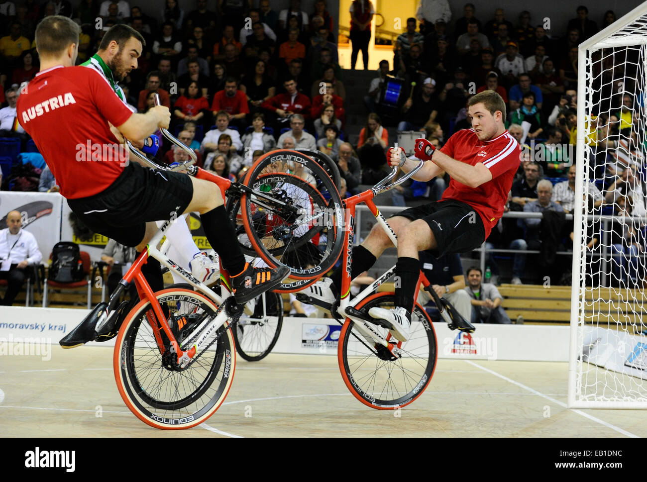 From left: Markus Broell of Austria, Dominik Planzer of Schwitzerland and Patrick Schnetzer of Austria pictured during the Cycle Ball final at the Indoor Cycling World Championships 2014 in Brno, Czech Republic, November 23, 2014. (CTK Photo/Vaclav Salek) Stock Photo