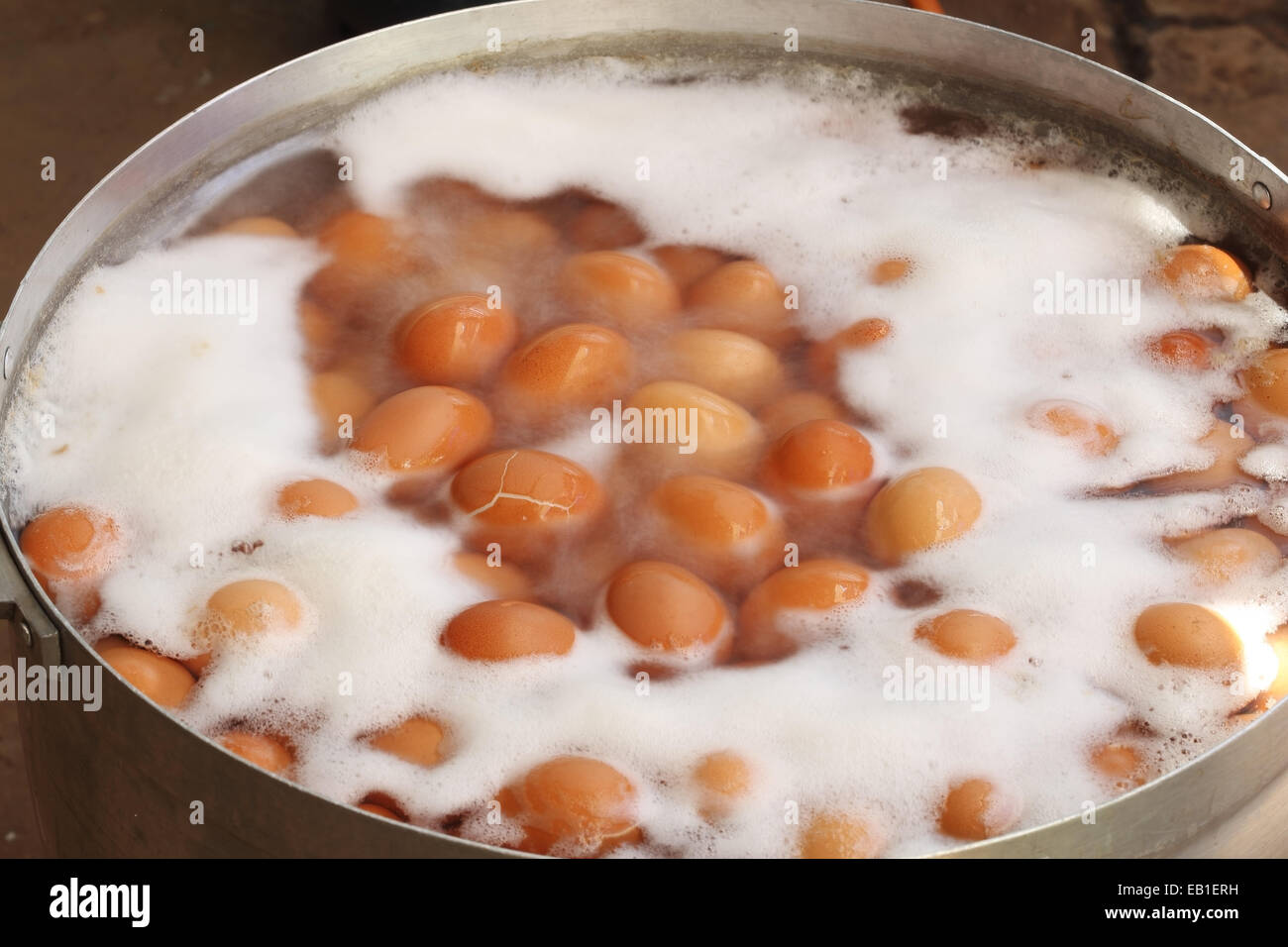 Image showcasing Eggs boiled with water in the big pot Stock Photo - Alamy