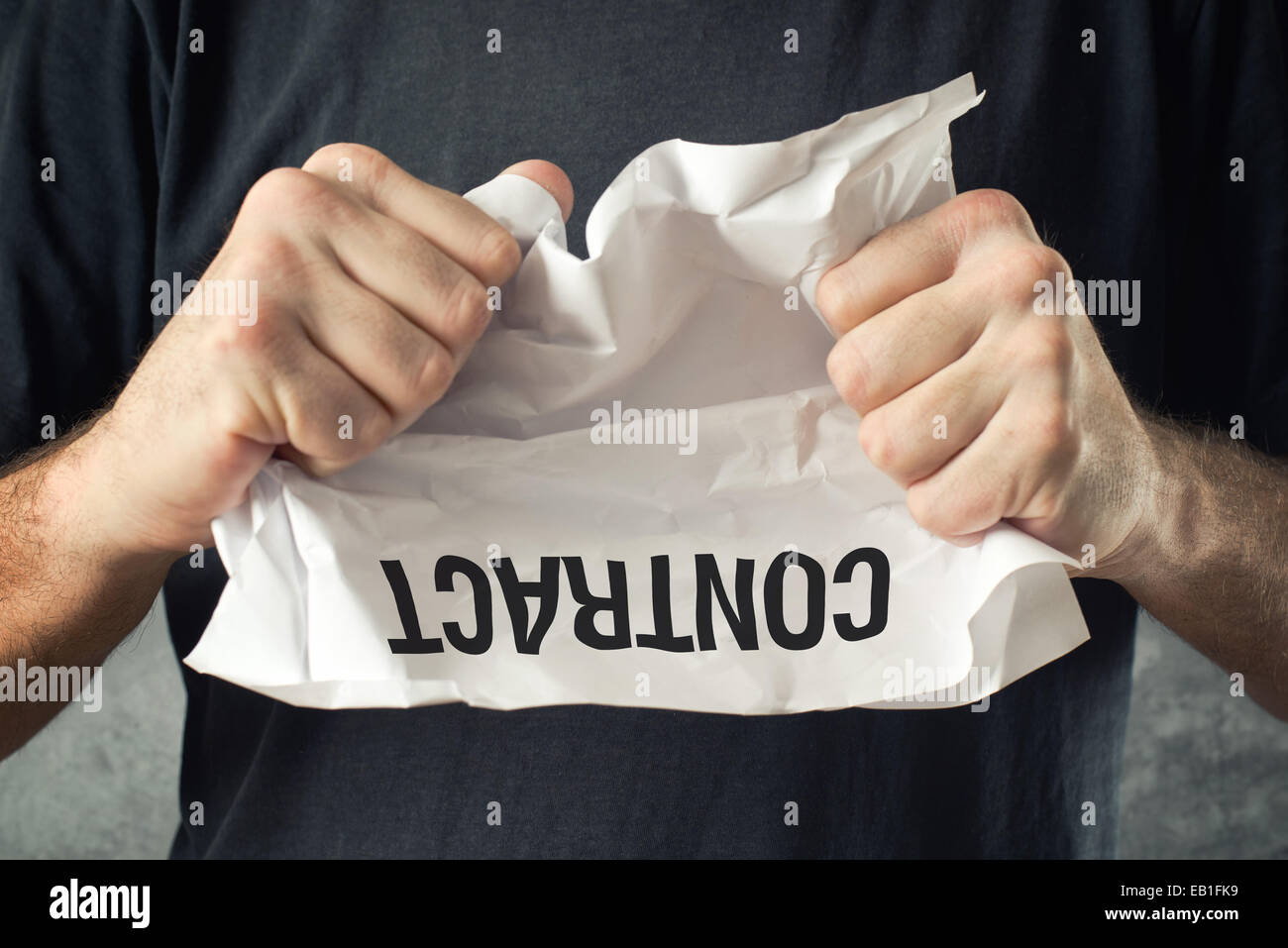Man tearing contract paper. Bad ideas or project mistakes concept. Stock Photo