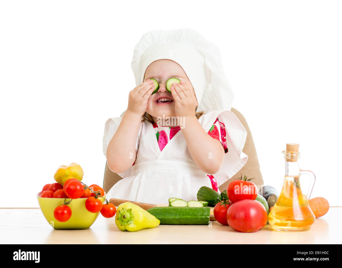 beautiful little girl with food vegetables Stock Photo