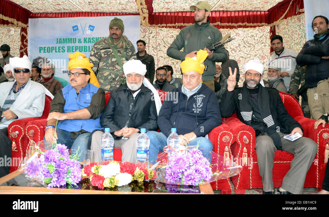 Srinagar, Kashmir. 24th November, 2014. Bollywood actor Aunpam sitting  during an election rally by the newly launched Peoples Republician Party (PRP) in Srinaga Bollywood actor Anupum Kher is campaign for the newly launched Peoples Republican Party (PRP) in Kashmir for the Assembly polls in the State. Voting begins in the five-phase election on November 25, with results due on December 23. Credit:  sofi suhail/Alamy Live News Stock Photo