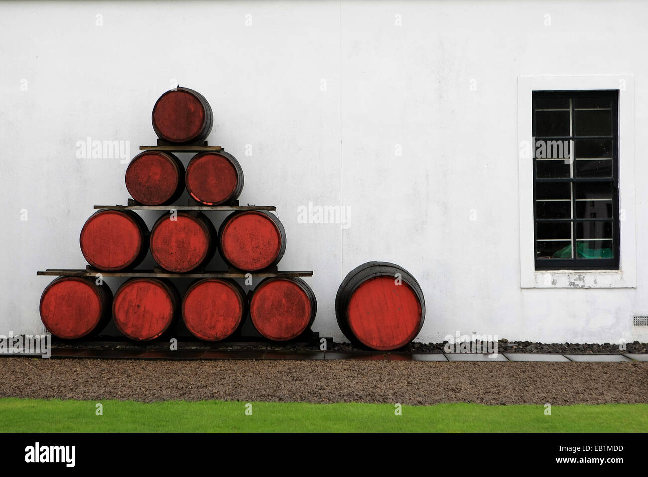 composition of old red wooden barrels of whiskey in the Isle of Arran Distillery.Lochranza,Scotland,UK Stock Photo