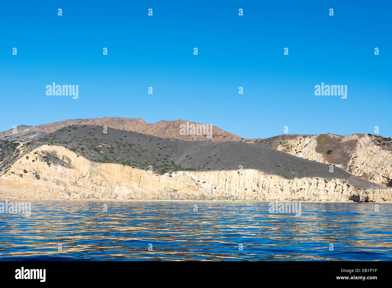 A remote island in the Channel Islands of California shows the geology of rugged, diverse terrain framed against deep turquoise Stock Photo