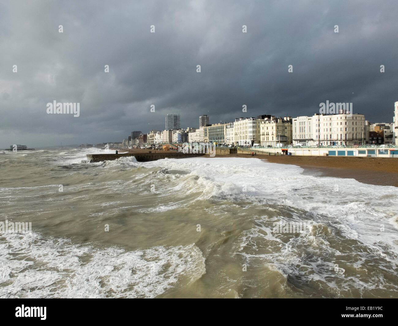 Heavy seas smash against the Brighton coastline in this picture taken from Brighton Pier Stock Photo