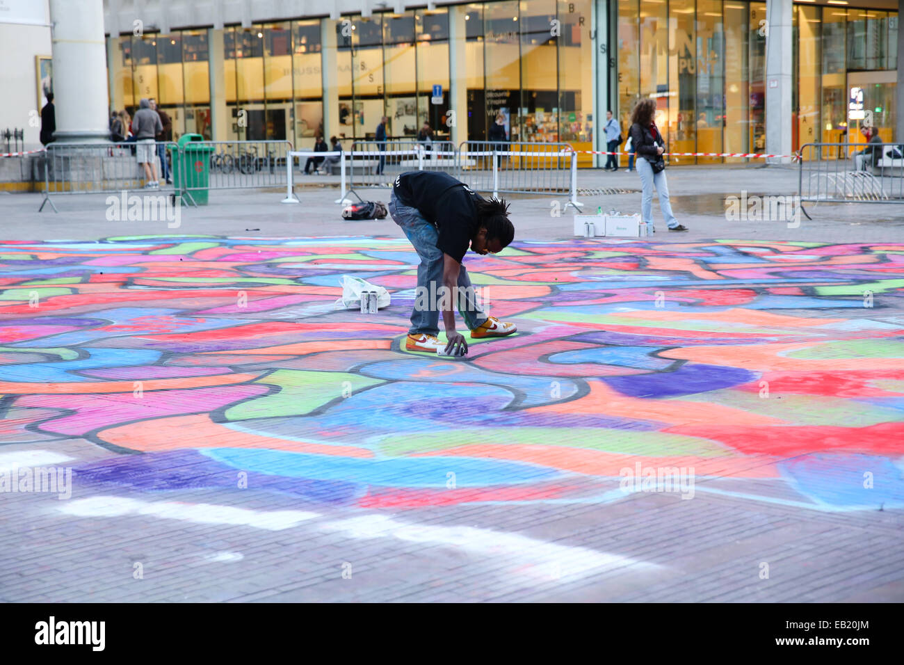 Black Artist Spray Painting Ground Outdoor Stock Photo Alamy