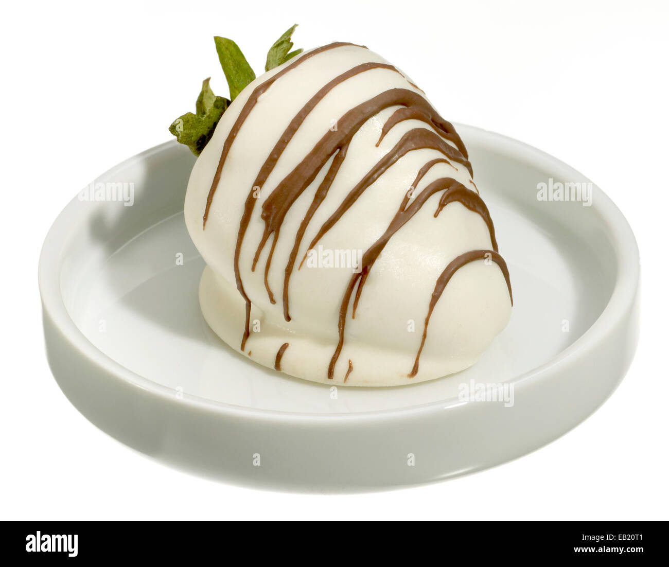 white chocolate covered strawberry on a white dish Stock Photo