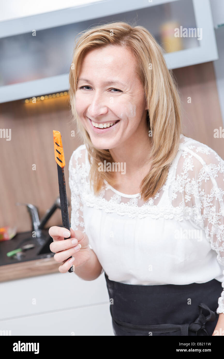 a woman making xmas cookies at home Stock Photo