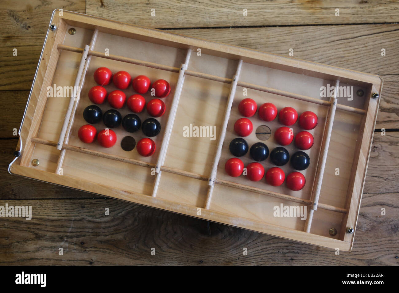 old wooden toy red black balls Stock Photo