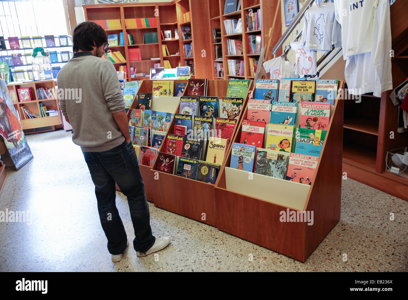 young man comic books shop Stock Photo