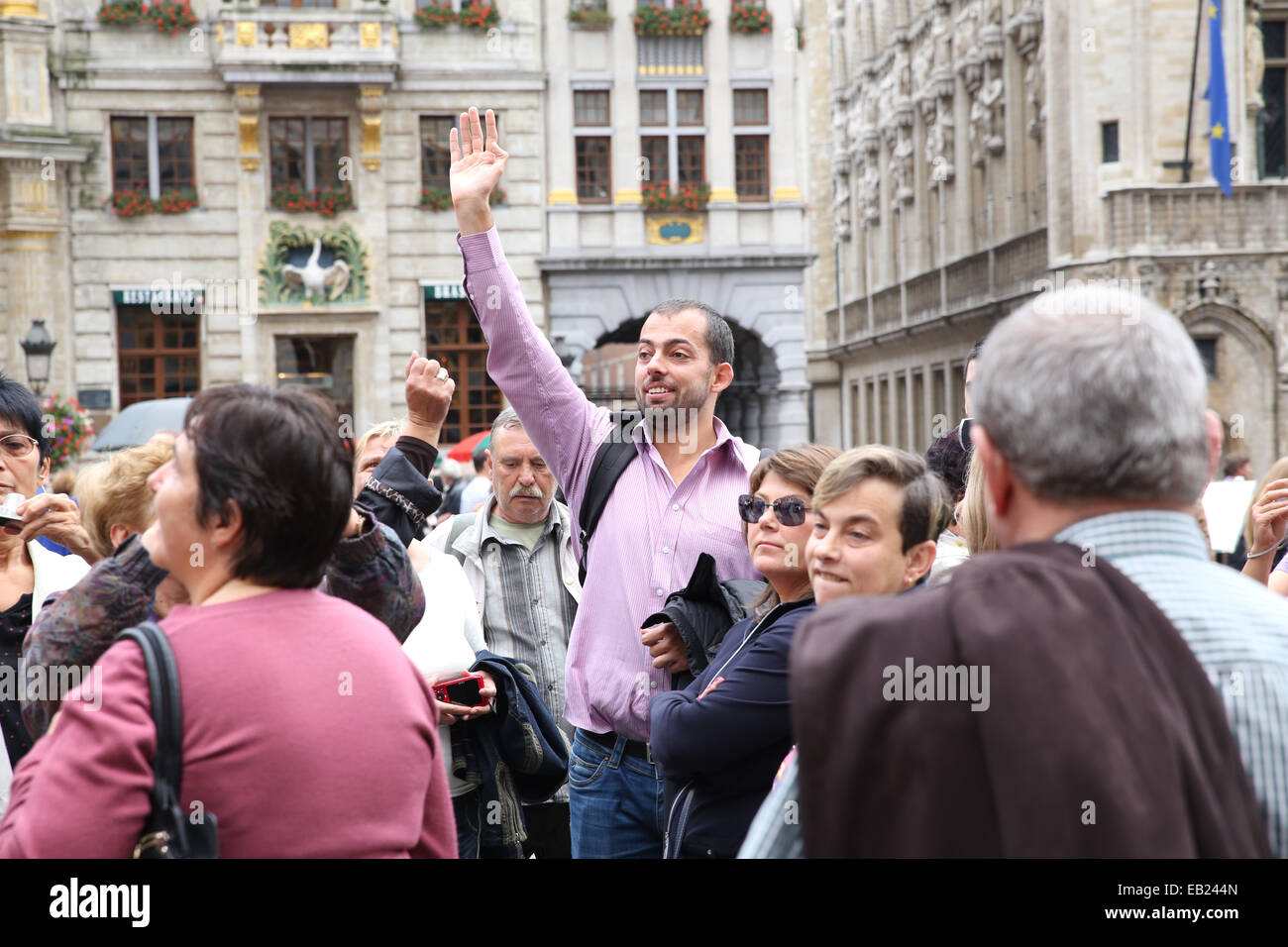 middle age man wave hand crowd europe Stock Photo