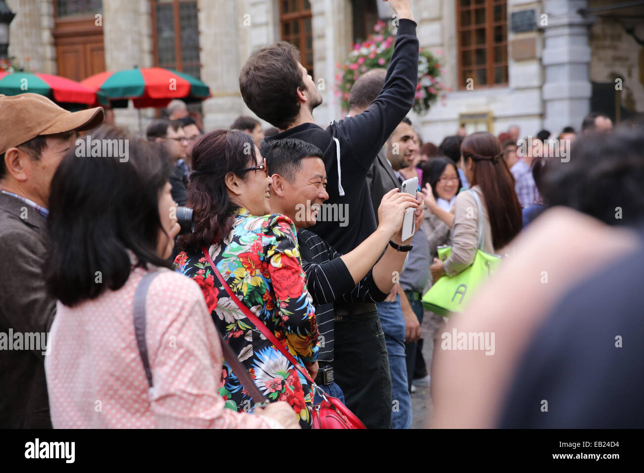 happy chinese tourist europe belgium brussels Stock Photo