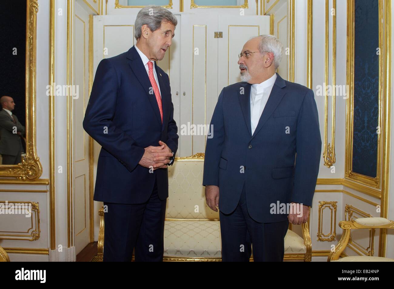 US Secretary of State John Kerry talks with Iranian Foreign Minister Javad Zarif before bilateral negotiations on the future of the Iranian nuclear program November 23, 2014 in Vienna, Austria. Stock Photo
