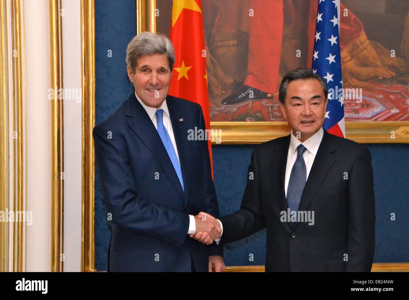 US Secretary of State John Kerry greets Chinese Foreign Minister Wang Yi before multinational discussions on the future of the Iranian nuclear program November 24, 2014 in Vienna, Austria. Stock Photo