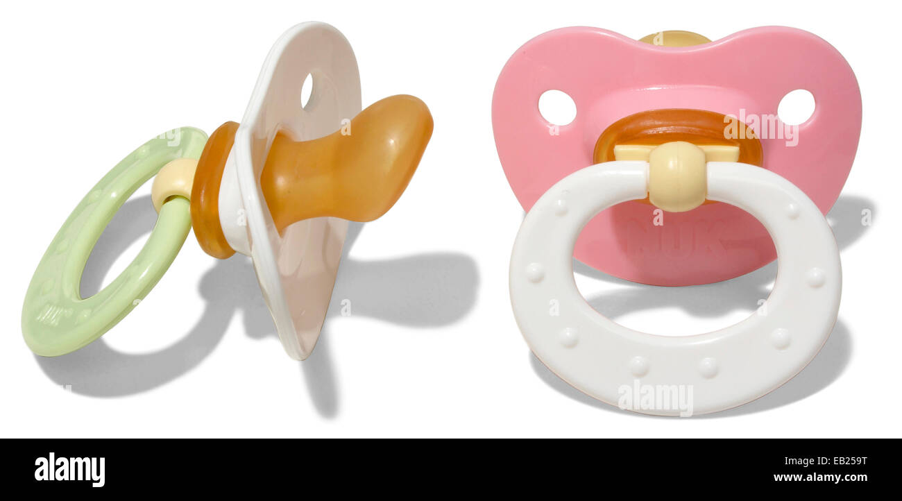 two gerber baby pacifiers pink and green and white Stock Photo