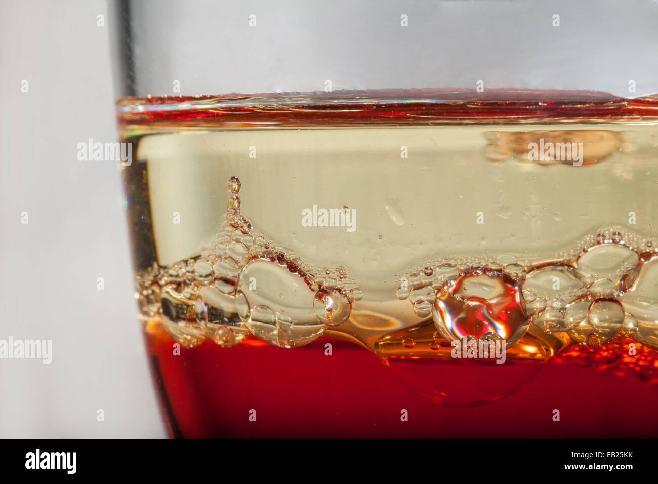 Heterogeneous liquids in a glass Stock Photo