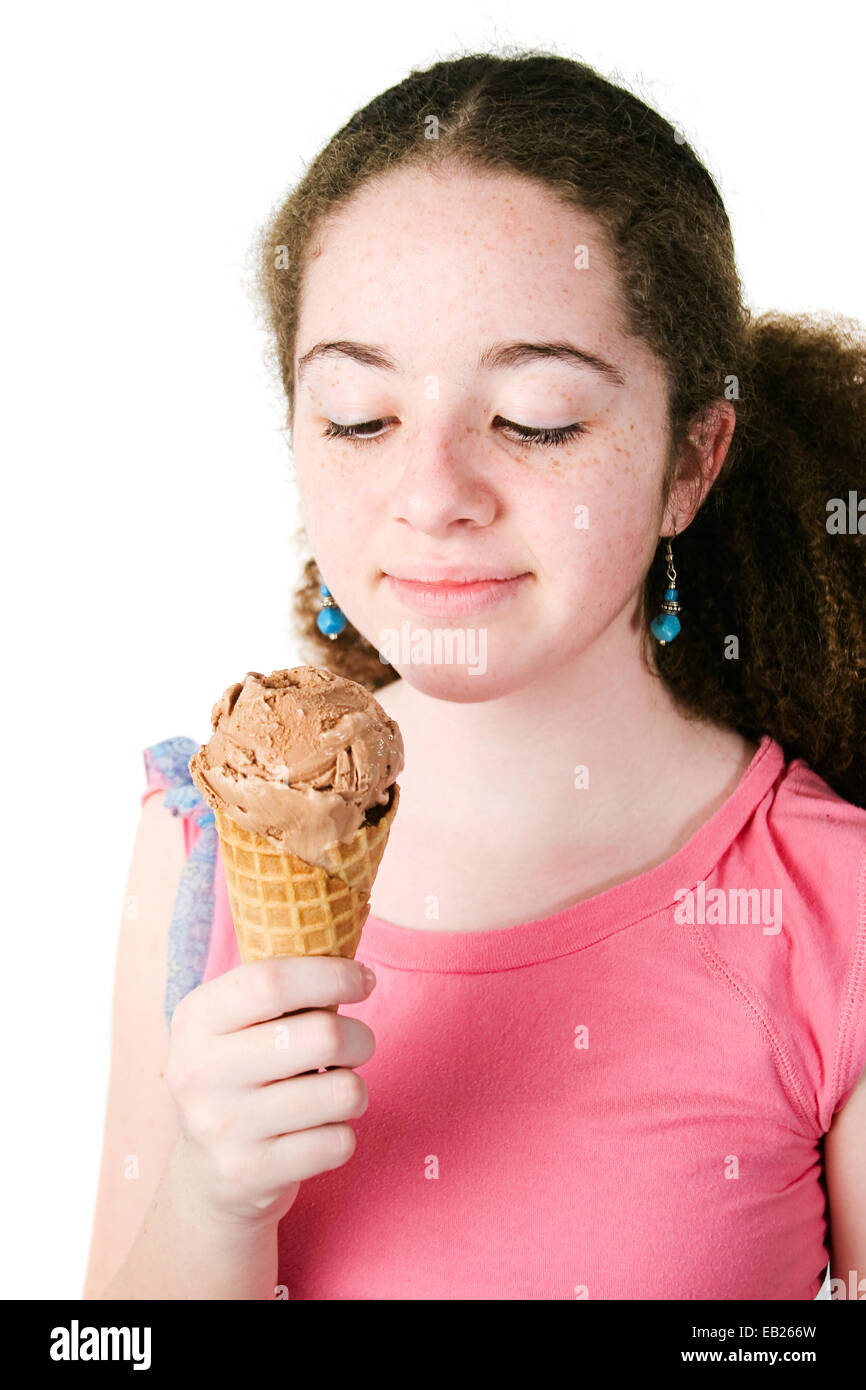 Pretty Hispanic Teen Girl With Curly Hair And Freckles Looking At
