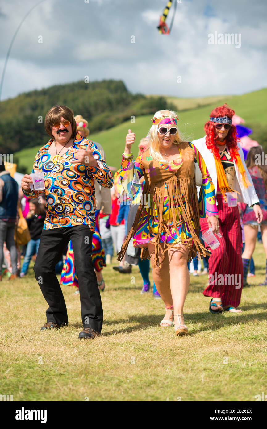 Audience members in 70's fancy dress clothes at the Big Tribute music festival Aberystwyth UK August bank holiday 2014 Stock Photo