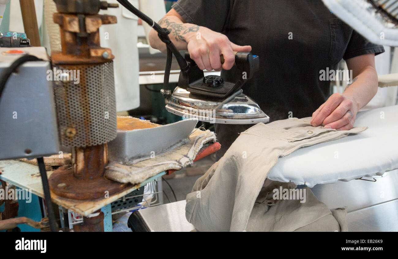 Broomfield, Colorado A worker at Lionheart Cleaners, a laundry and