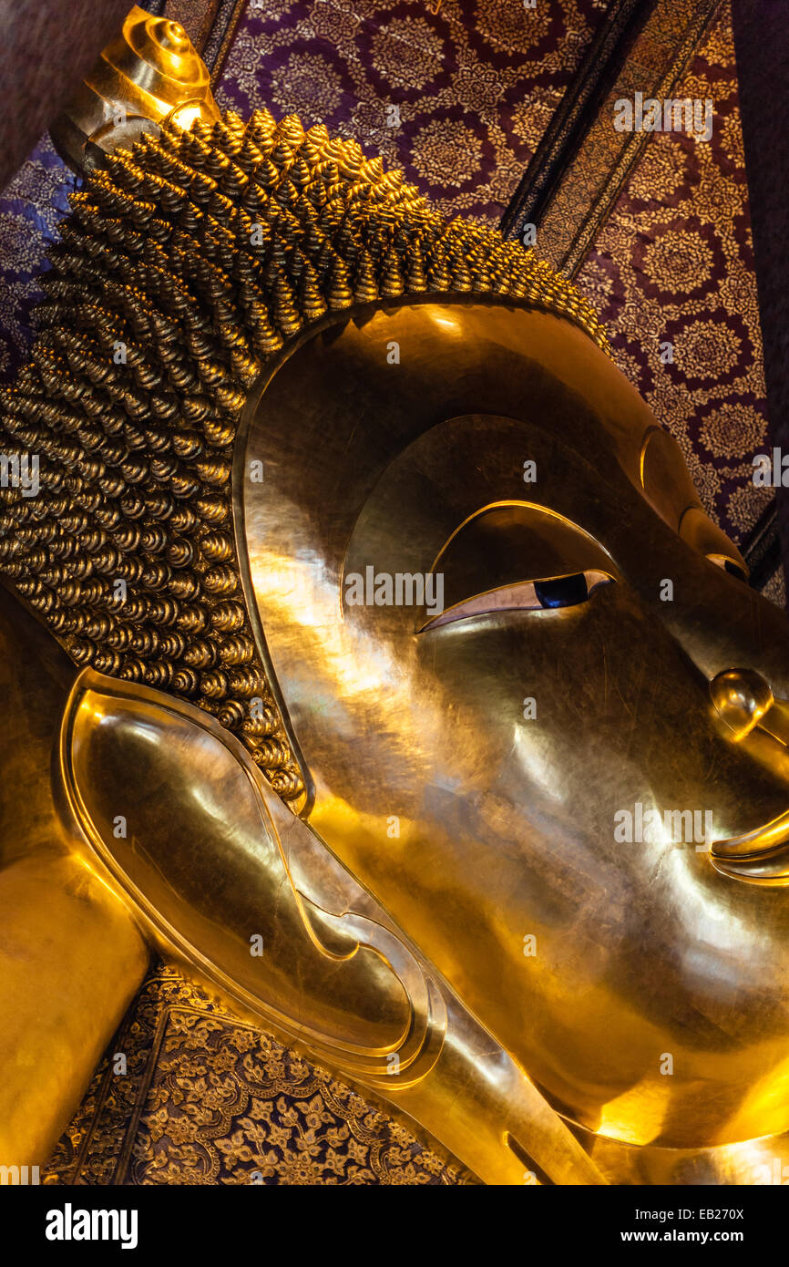 Reclining Buddha gold statue face. Wat Pho, Bangkok, Thailand Stock ...