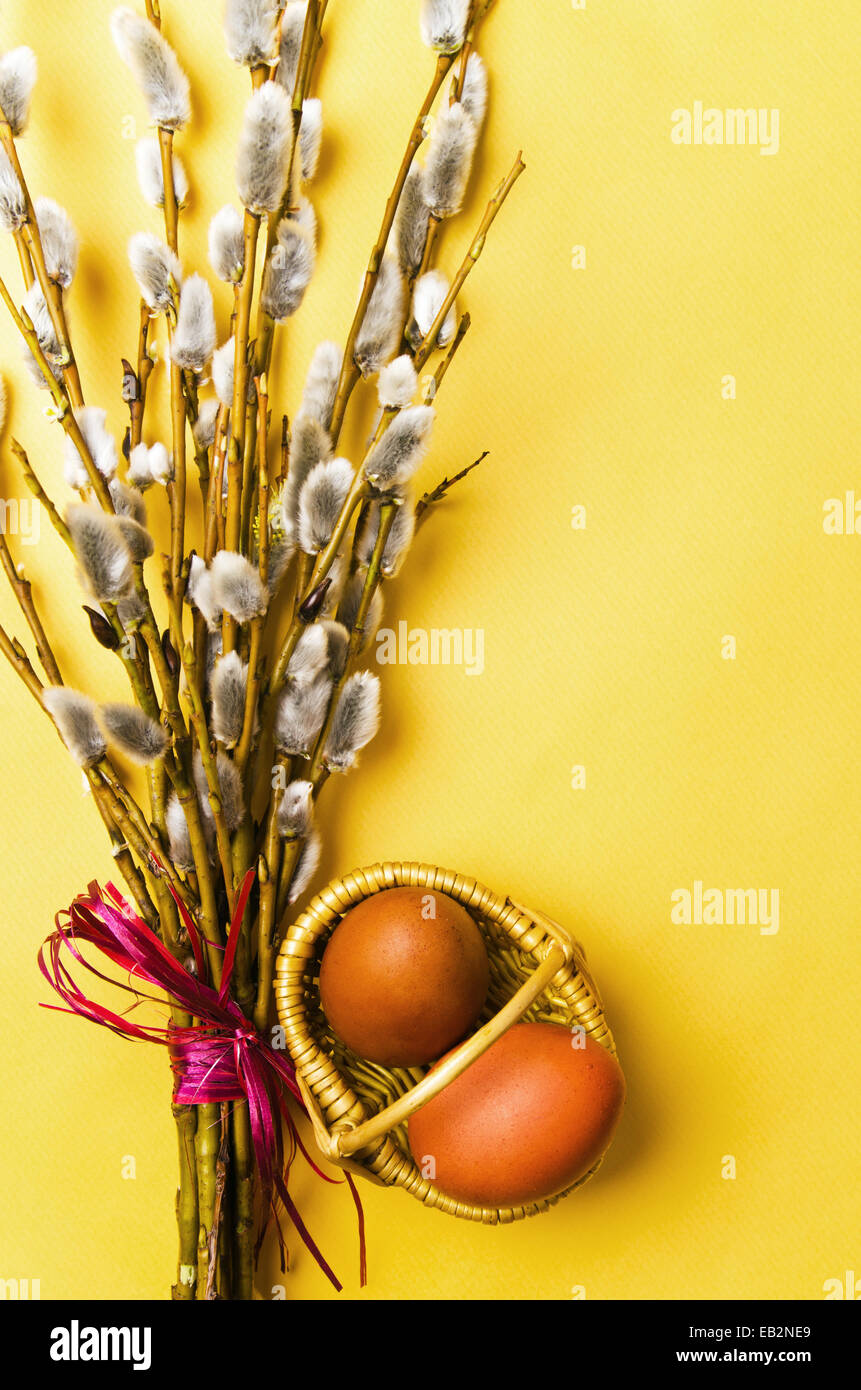 bunch of willow branches and two Easter eggs in basket Stock Photo - Alamy