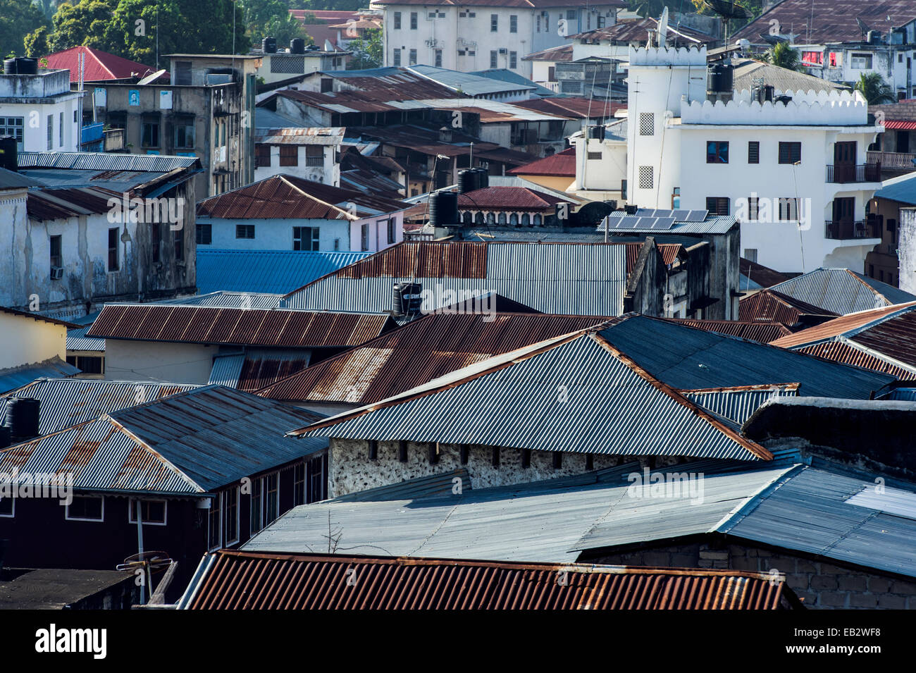 Rusting corrugated tin roofs crowded together in an ancient trading port. Stock Photo