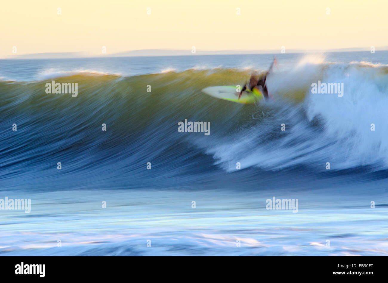 Motion blur of a surfer at dusk at Pitas Point in Ventura, California. Stock Photo