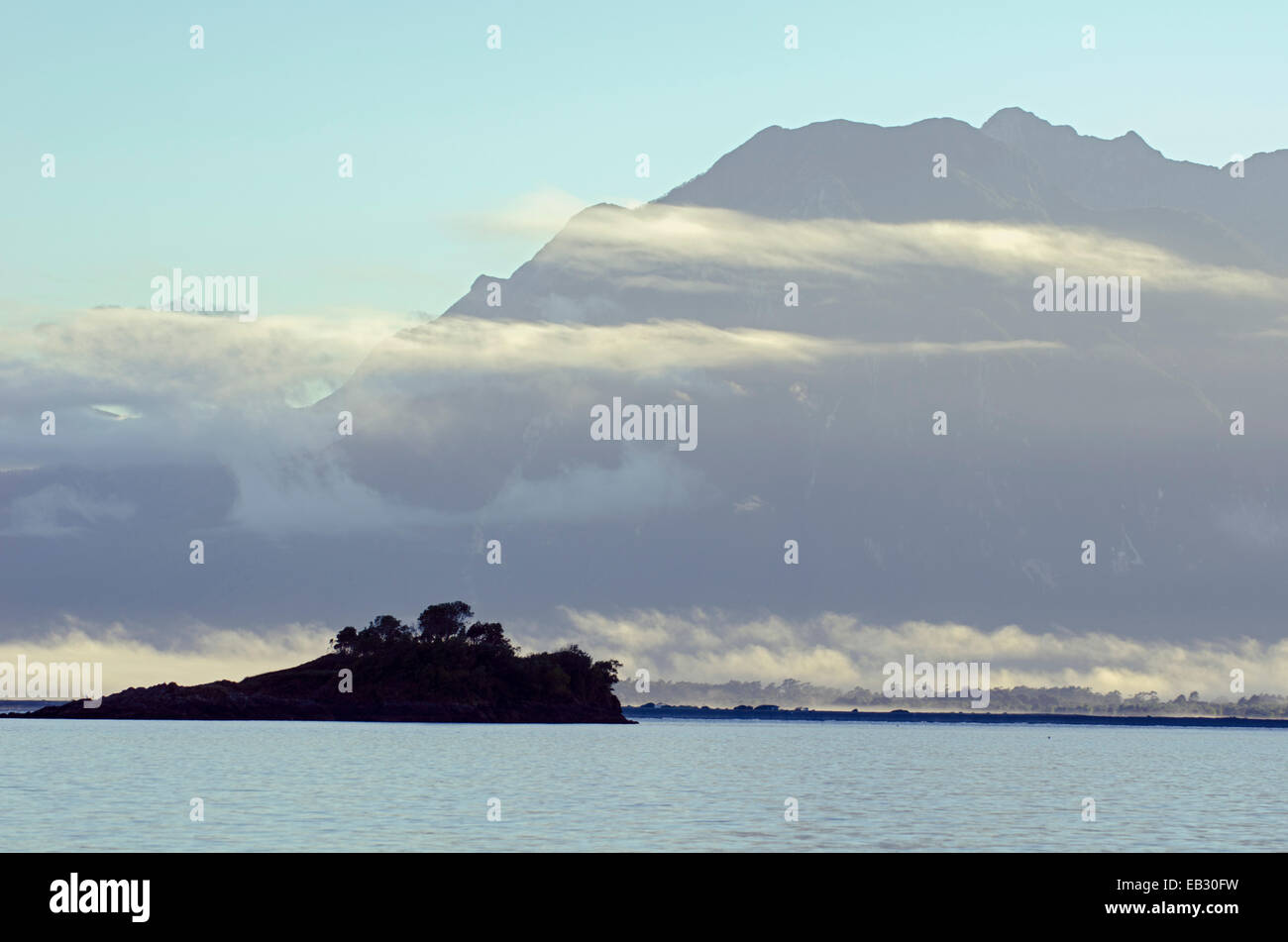 Low fog around islands and mountains near Chaiten in Southern Chile. Stock Photo