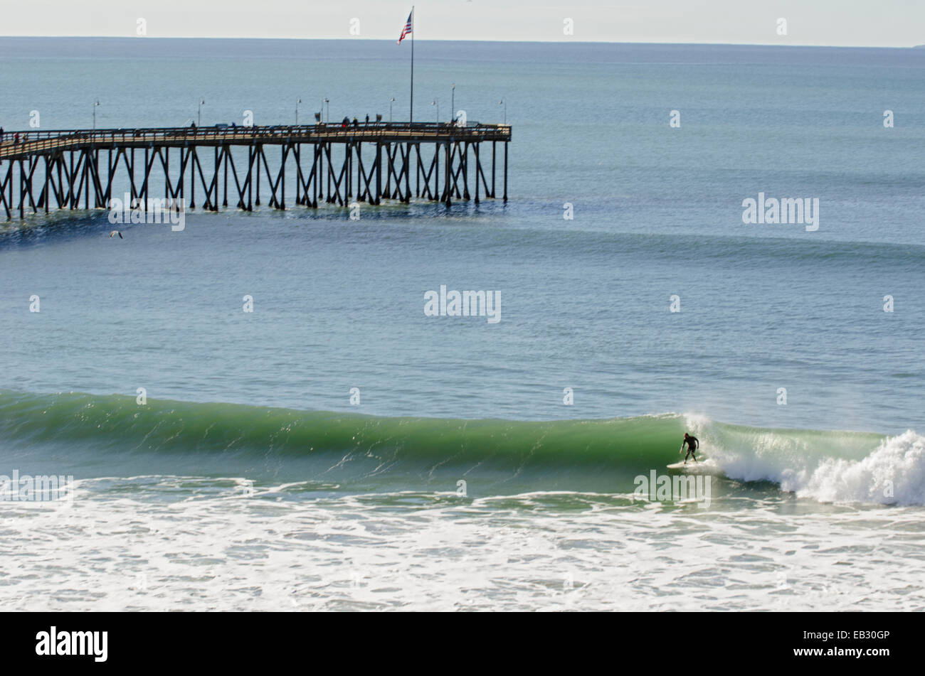 Surfer catching a wave at Surfers Point near the San Buenaventura pier. Stock Photo