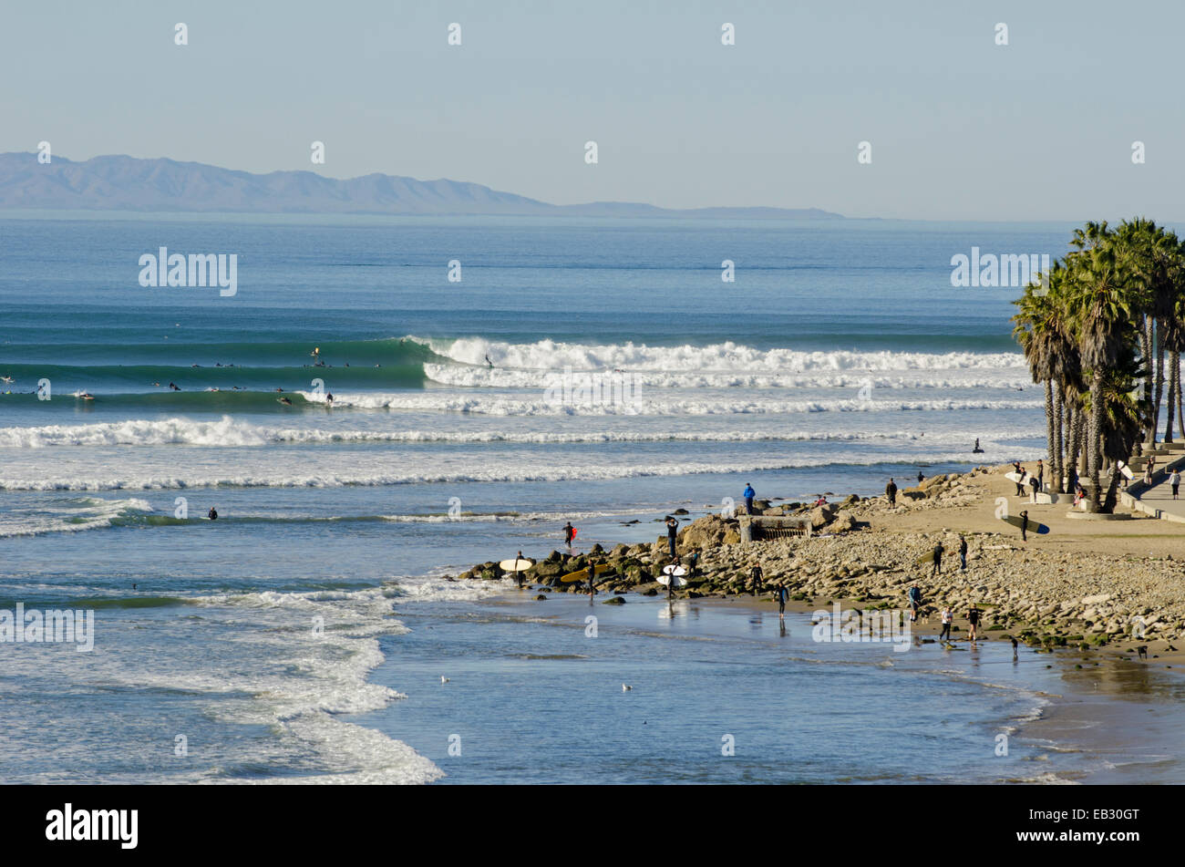 Winter swell and surfers at Surfers Point. Stock Photo