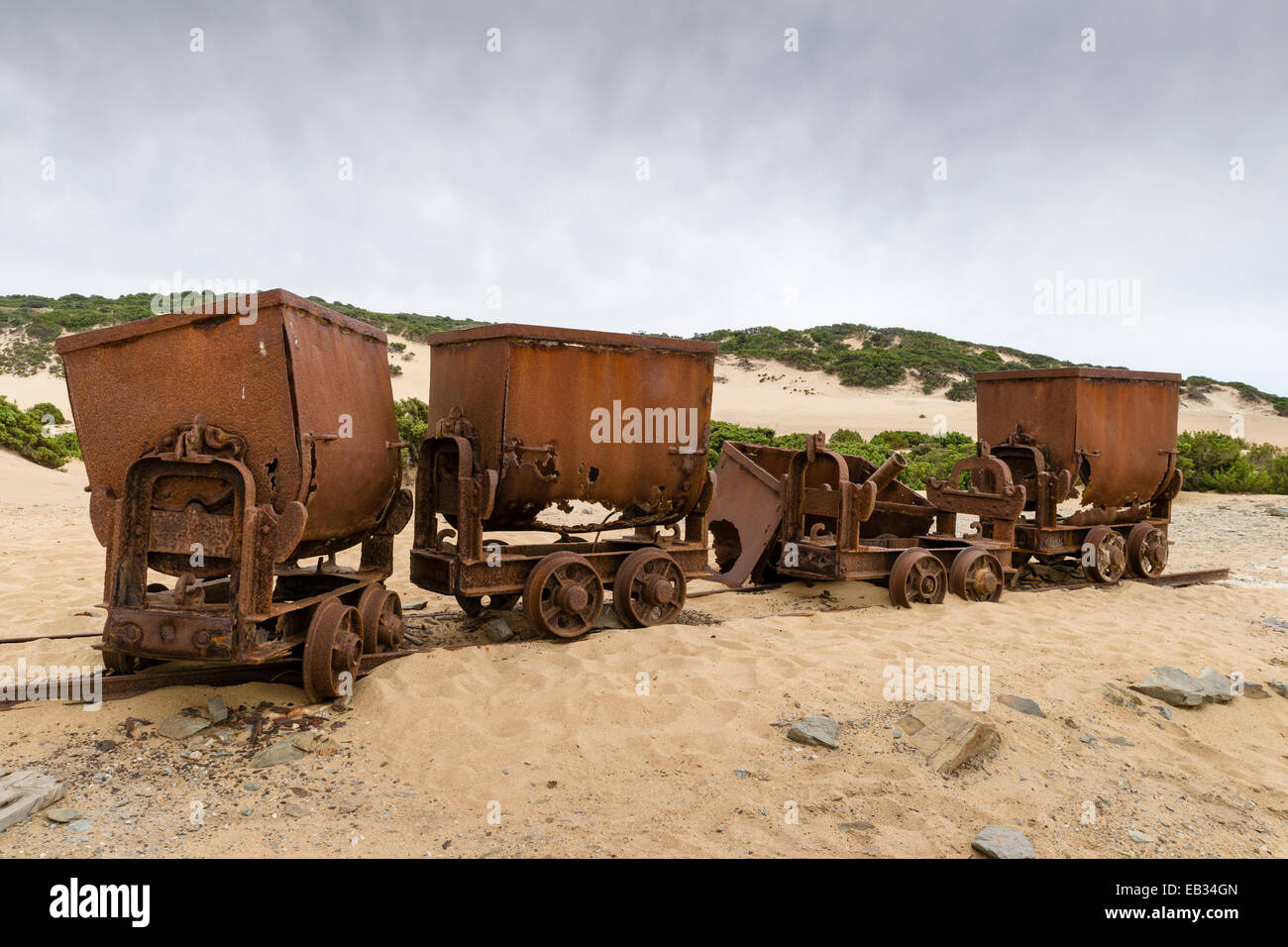Tippers or tipping wagons on old mine tracks in the dunes, Dune di Piscinas d'Ingurtosu, Arbus, Sardinia, Italy Stock Photo